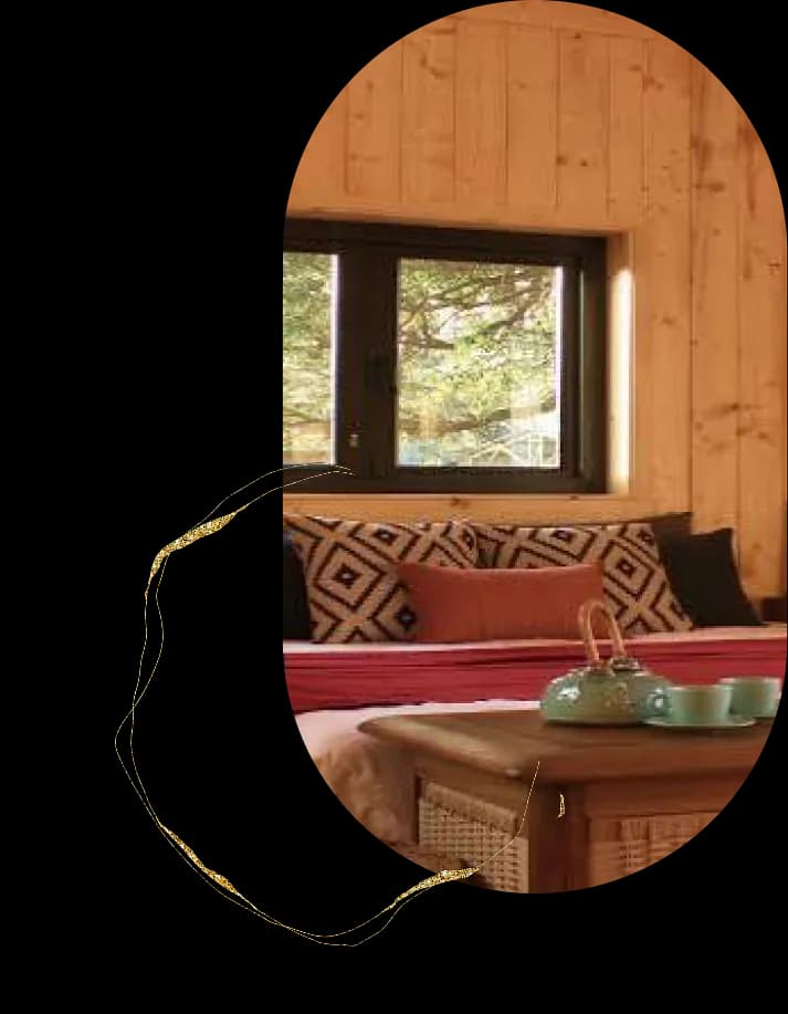 Wooden ceiling eco room with cozy bed and warm lighting